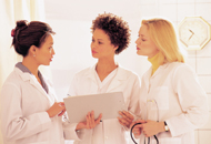 Three female Medical Professionals talking to each other