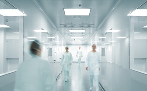 Four Medical Professionals walking through a hallway